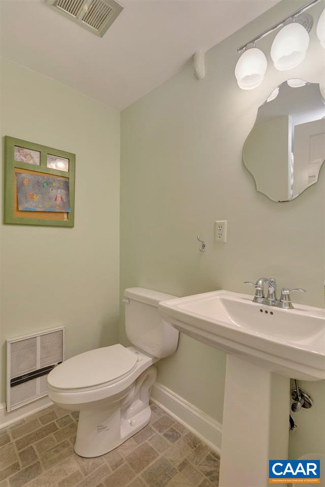 202 Sturbridge Road Charlottesville, VA 22901 - Photo 48 of 49 a bathroom with a sink a toilet and mirror