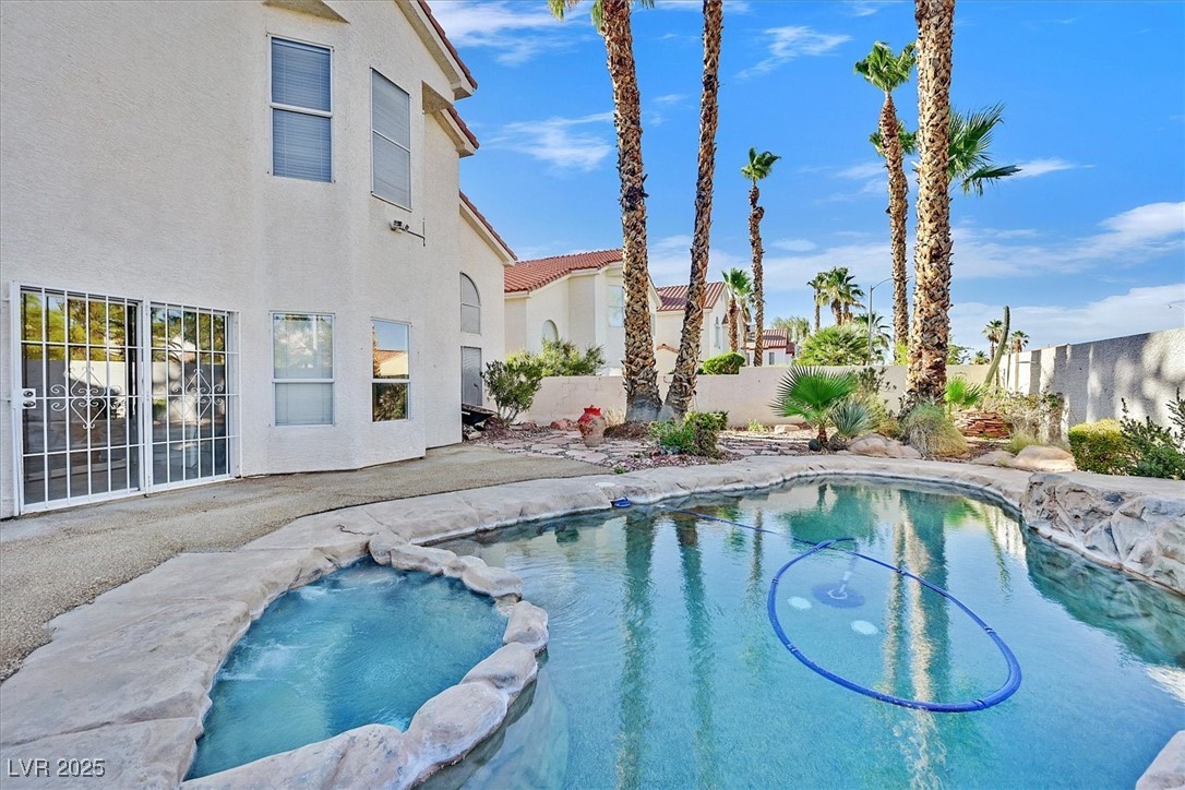 234 Highgate Street Henderson, NV 89074 - Photo 22 of 22 View of pool with a pool with connected hot tub and a patio area