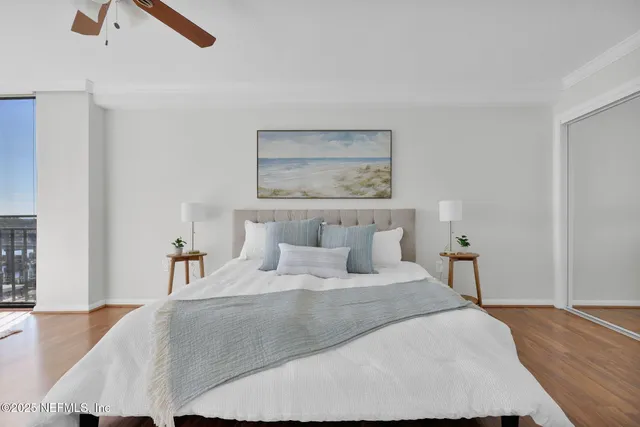 an aerial view of a house with yard lake view and boat