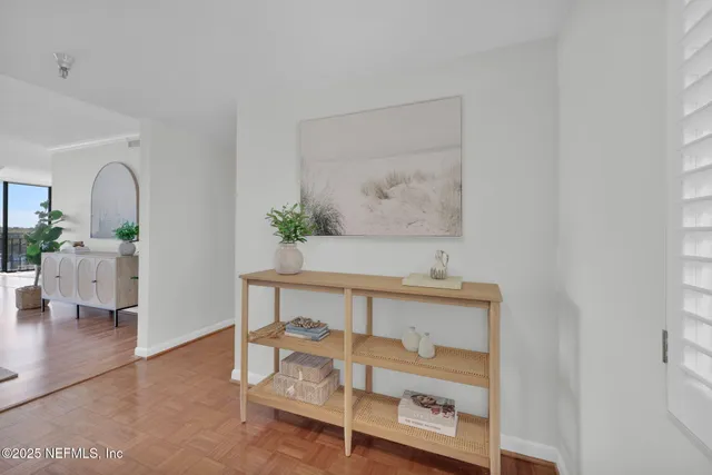 a view of an entryway with wooden floor