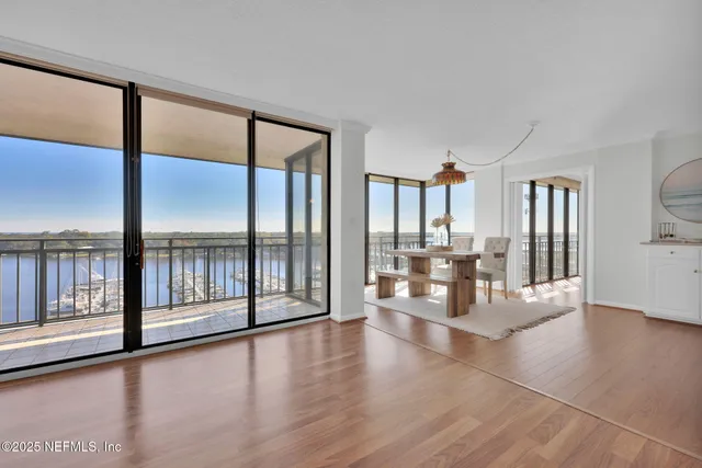 a kitchen with a sink dishwasher a stove and a refrigerator with wooden floor