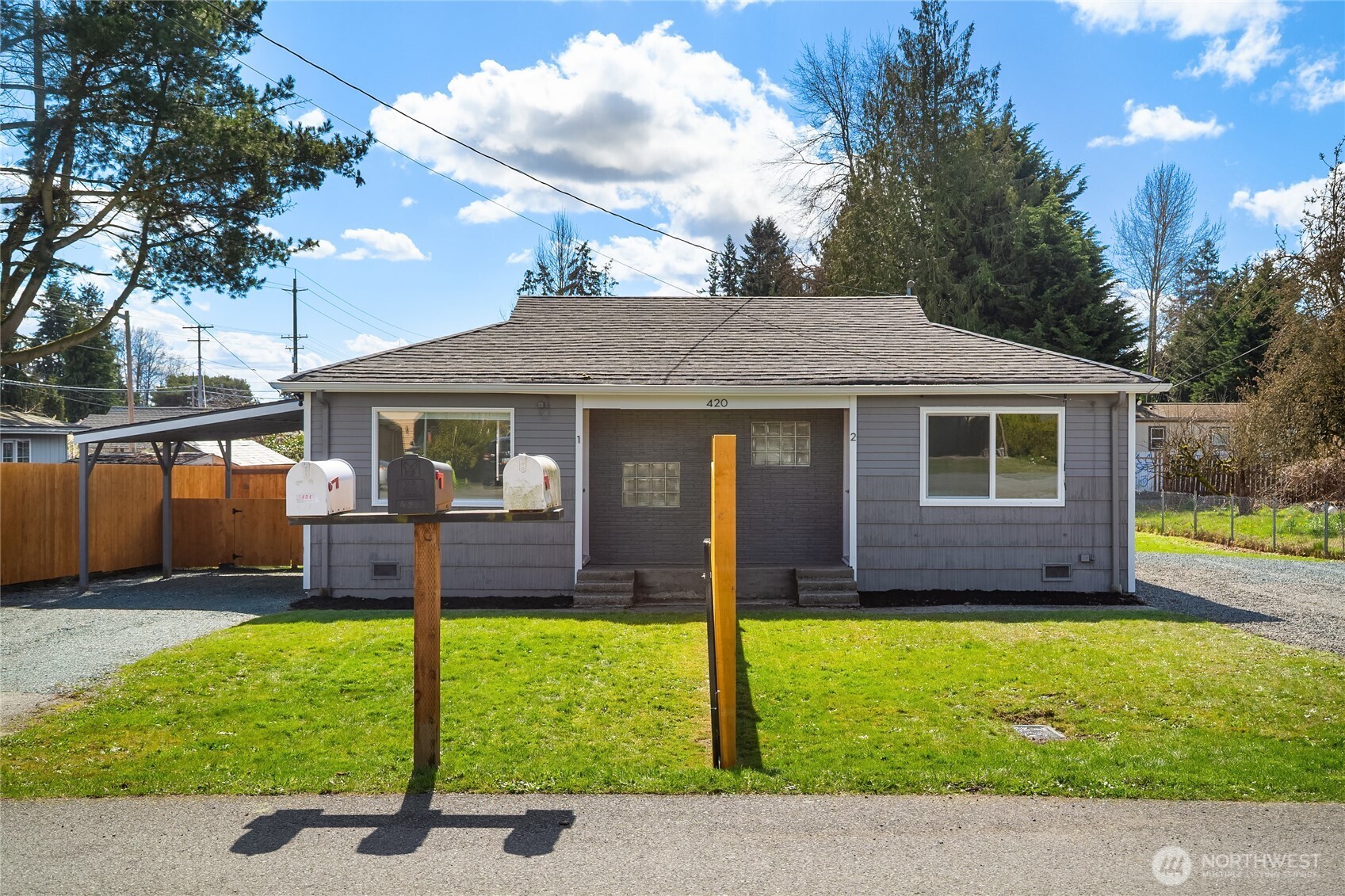 420 107th Place Southwest, Unit 1 Everett, WA 98204 - Photo 15 of 15 a front view of house with a garden and patio
