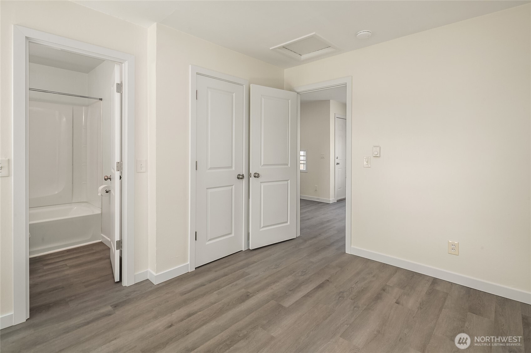 420 107th Place Southwest, Unit 1 Everett, WA 98204 - Photo 7 of 15 a view of empty room with wooden floor