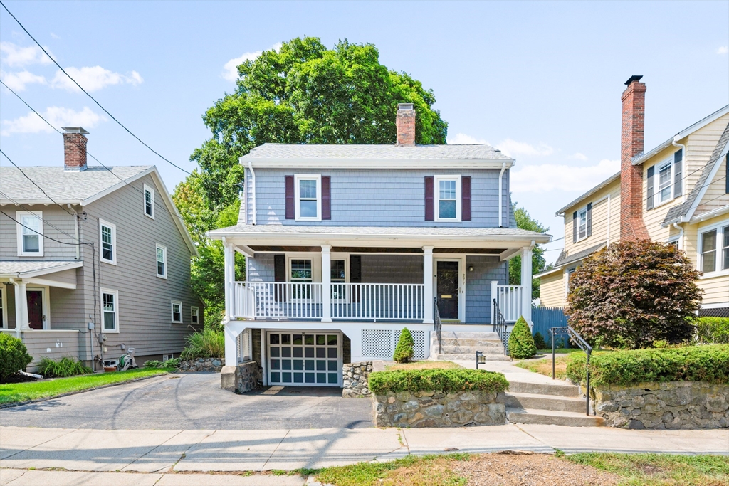 277 Appleton Street Arlington, MA 02476 - Photo 1 of 21 a view of a brick house with a yard plants and large tree