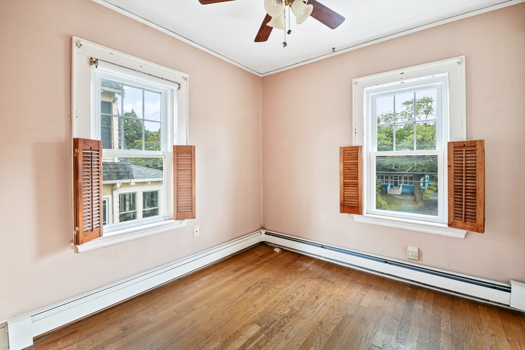 277 Appleton Street Arlington, MA 02476 - Photo 16 of 21 a view of an empty room with wooden floor and a window
