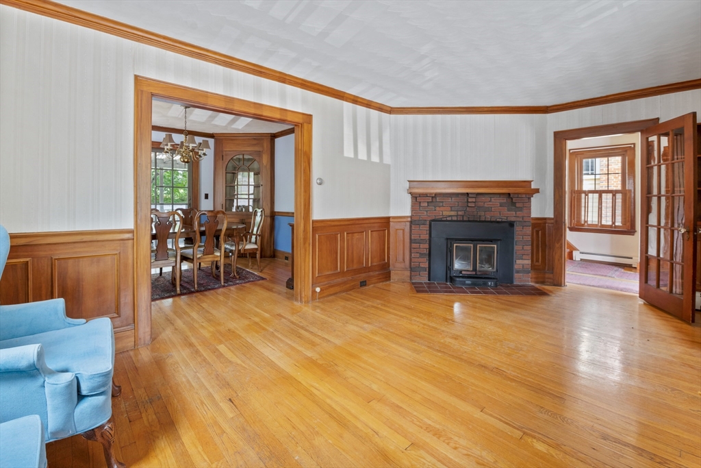 277 Appleton Street Arlington, MA 02476 - Photo 3 of 21 a living room with furniture and a fireplace