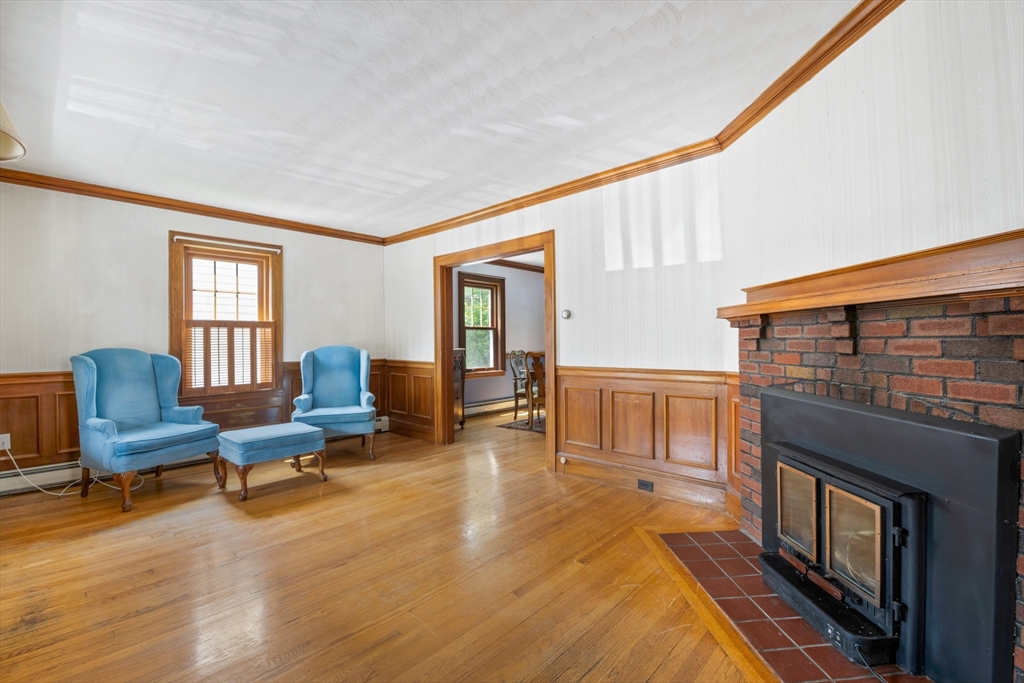277 Appleton Street Arlington, MA 02476 - Photo 4 of 21 a living room with furniture and a fireplace