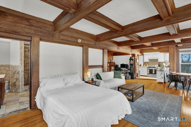 11 Winthrop Road, Unit B West Hartford, CT 06110 - Photo 15 of 27 a bedroom with furniture and a large window