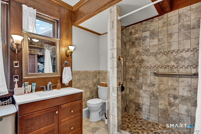 11 Winthrop Road, Unit B West Hartford, CT 06110 - Photo 19 of 27 a bathroom with a sink a toilet and shower