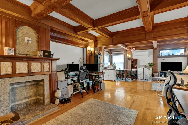 a view of a livingroom with furniture and a fireplace