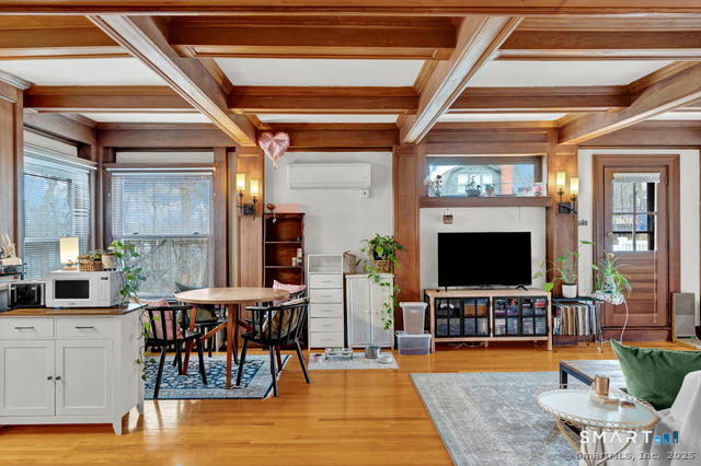 11 Winthrop Road, Unit B West Hartford, CT 06110 - Photo 5 of 27 a living room with furniture and a flat screen tv