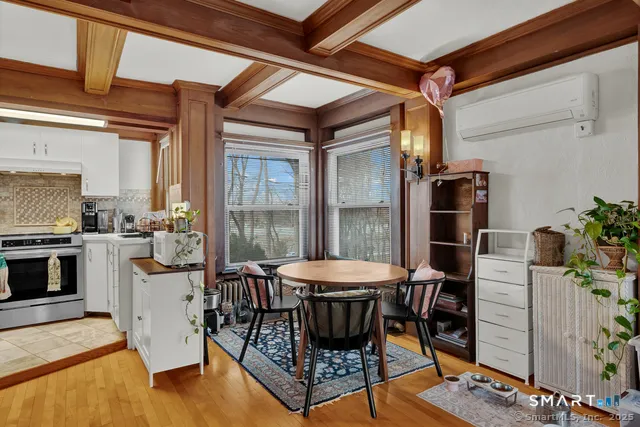a kitchen with stainless steel appliances granite countertop a refrigerator and a counter top space