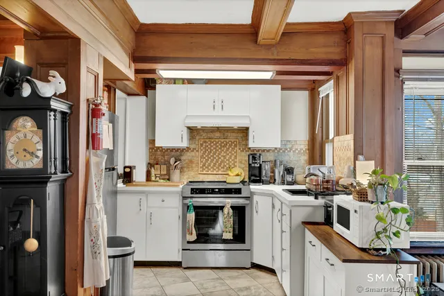 a view of a dining room with furniture and a window