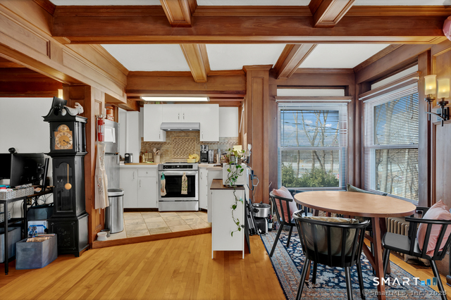 11 Winthrop Road, Unit B West Hartford, CT 06110 - Photo 10 of 27 a view of a dining room with furniture and a window