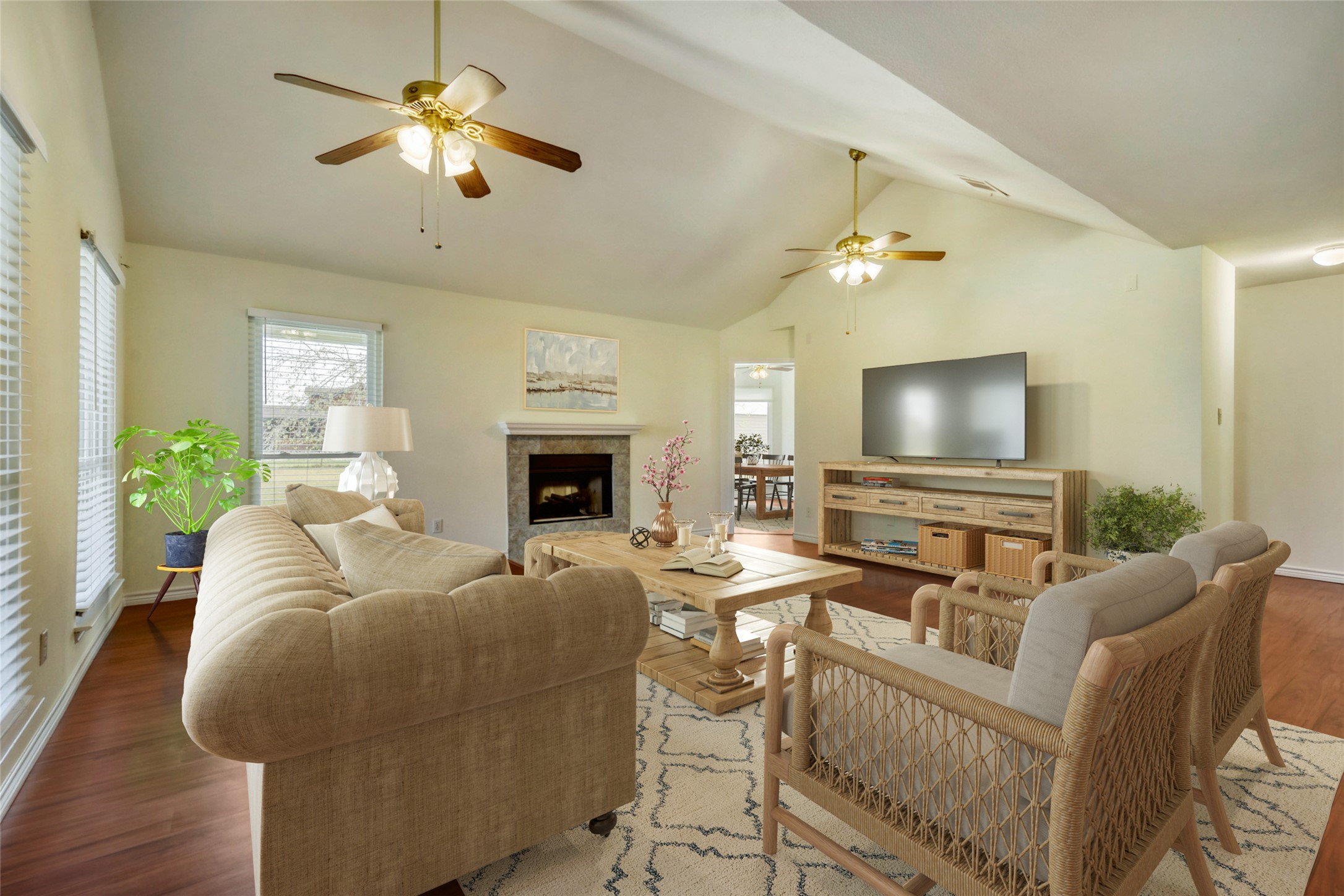 2601 Windy Ridge Road Taylor, TX 76574 - Photo 5 of 30 Living area with wood finished floors, a ceiling fan, a fireplace, and a high ceiling