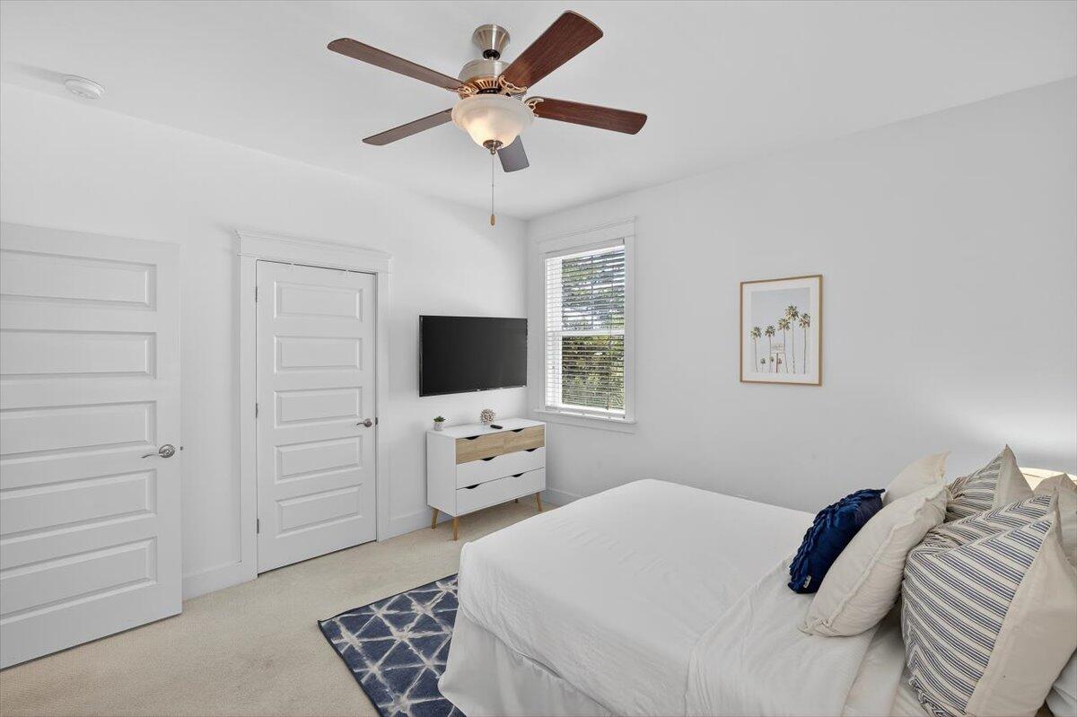28 Emerald Beach Circle Santa Rosa Beach, FL 32459 - Photo 21 of 44 a bedroom with a bed and a flat screen tv