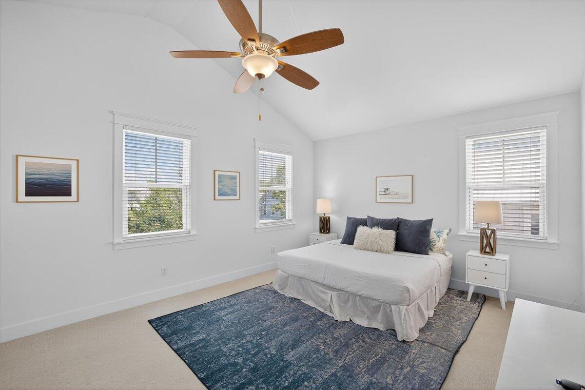 28 Emerald Beach Circle Santa Rosa Beach, FL 32459 - Photo 27 of 44 a bedroom with a large bed and a chandelier