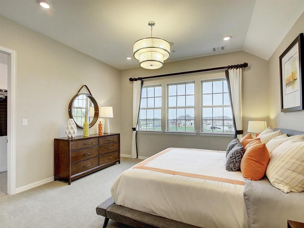 5634 Niagara Road The Colony, TX 75056 - Photo 14 of 31 a bedroom with a bed and a dresser