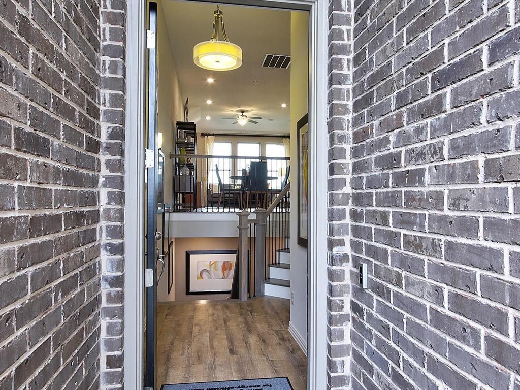 5634 Niagara Road The Colony, TX 75056 - Photo 2 of 31 a view of a brick wall with a bathroom