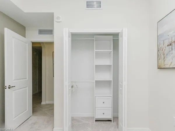 a view of an empty walk in closet