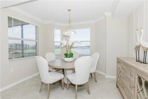 a view of a dining room with furniture window and outside view