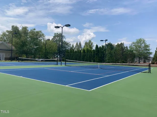 swimming pool view with a seating space