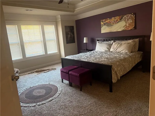 a bedroom with a bed and window