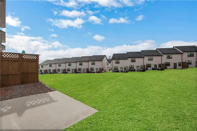 a front view of house with yard and outdoor seating