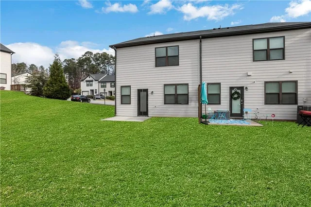 a front view of a house with a yard