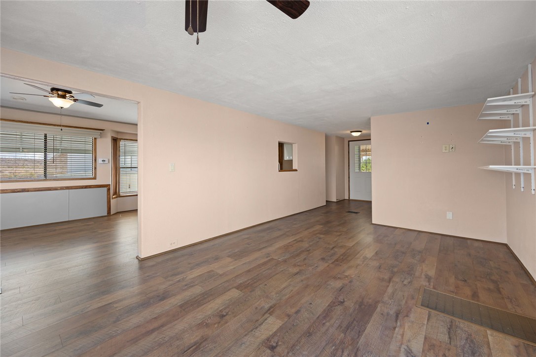 2000 Ramar Road, Unit 587 Bullhead City, AZ 86442 - Photo 18 of 79 Bright living area with vaulted ceiling and ceiling fan and Golf course and Mountain View?s with access to large deck And seamless access to kitchen and dining area