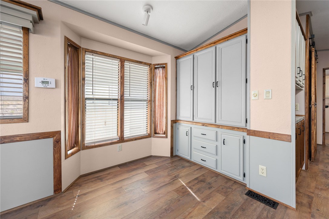 2000 Ramar Road, Unit 587 Bullhead City, AZ 86442 - Photo 22 of 79 Dining area with a view and built-in storage ? perfect for displaying or keeping essentials close at hand.