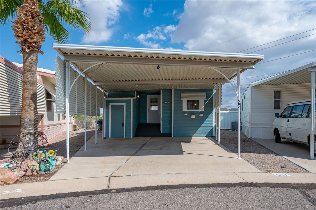2000 Ramar Road, Unit 587 Bullhead City, AZ 86442 - Photo 3 of 79 Charming front entry with shaded double carport and shed