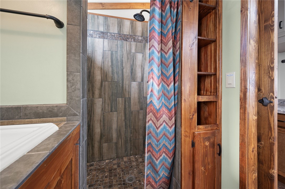 2000 Ramar Road, Unit 587 Bullhead City, AZ 86442 - Photo 32 of 79 Bathroom featuring a updated tile shower and vanity