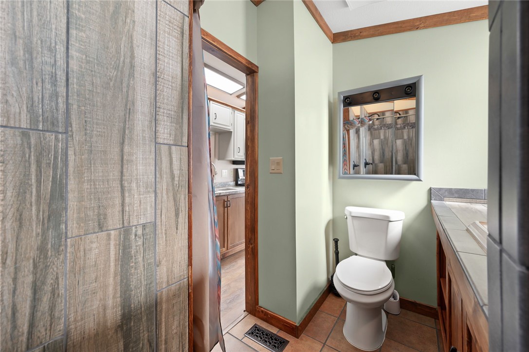 2000 Ramar Road, Unit 587 Bullhead City, AZ 86442 - Photo 34 of 79 Bathroom with vanity and light tile patterned floors