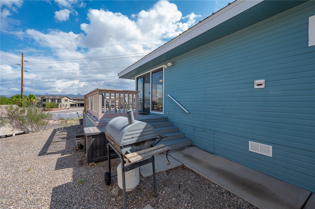 2000 Ramar Road, Unit 587 Bullhead City, AZ 86442 - Photo 40 of 79 View of property exterior featuring a deck