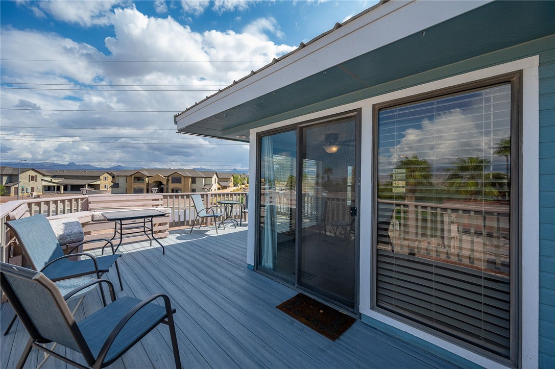 2000 Ramar Road, Unit 587 Bullhead City, AZ 86442 - Photo 42 of 79 Expansive deck with golf course and mountain views. Perfect spot for sunset cocktails and gatherings.