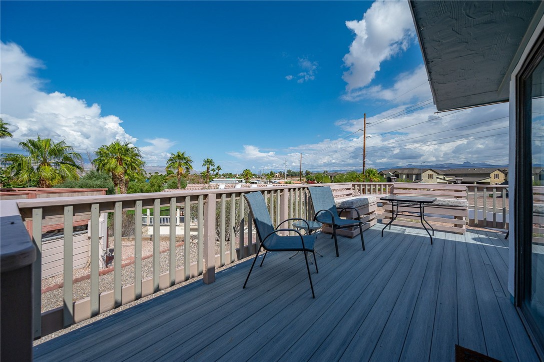 2000 Ramar Road, Unit 587 Bullhead City, AZ 86442 - Photo 43 of 79 Expansive deck with golf course and mountain views. Perfect spot for sunset cocktails and gatherings.