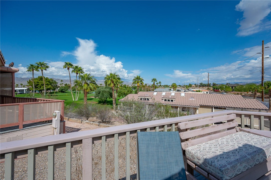 2000 Ramar Road, Unit 587 Bullhead City, AZ 86442 - Photo 44 of 79 Expansive deck with golf course and mountain views. Perfect spot for sunset cocktails and gatherings.