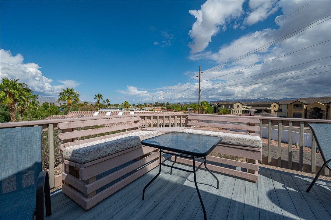 2000 Ramar Road, Unit 587 Bullhead City, AZ 86442 - Photo 45 of 79 Expansive deck with golf course and mountain views. Perfect spot for sunset cocktails and gatherings.