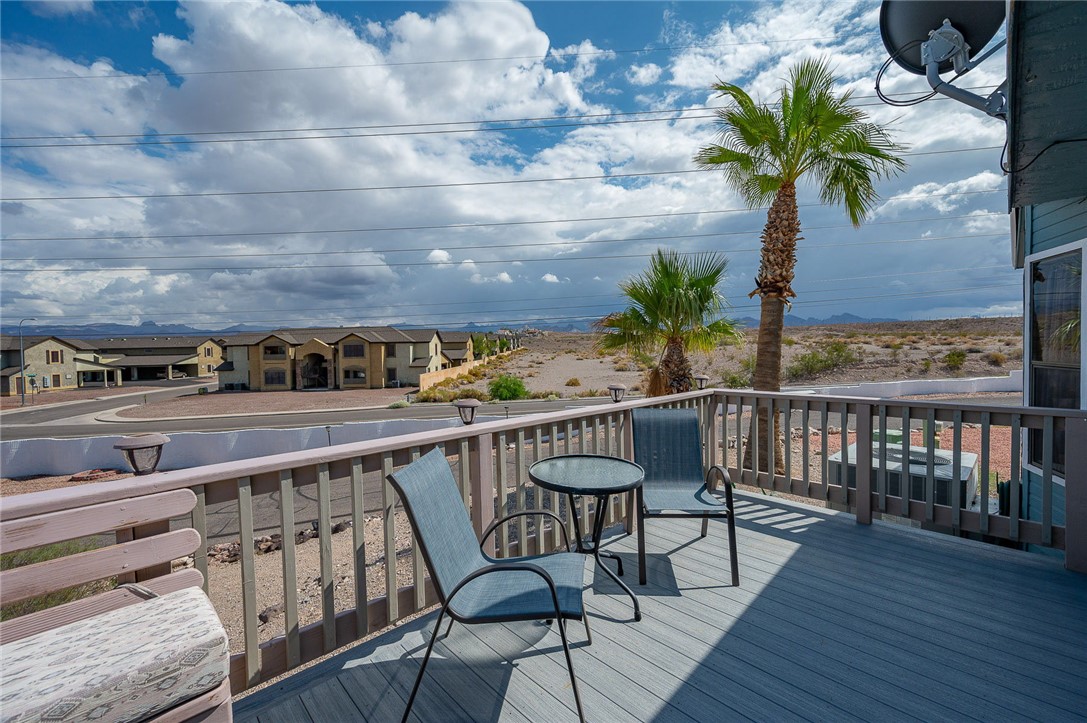 2000 Ramar Road, Unit 587 Bullhead City, AZ 86442 - Photo 46 of 79 Expansive deck with golf course and mountain views. Perfect spot for sunset cocktails and gatherings.