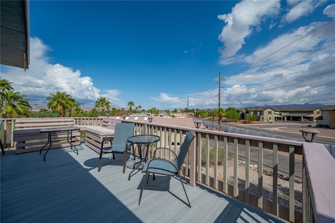 2000 Ramar Road, Unit 587 Bullhead City, AZ 86442 - Photo 47 of 79 Expansive deck with golf course and mountain views. Perfect spot for sunset cocktails and gatherings.