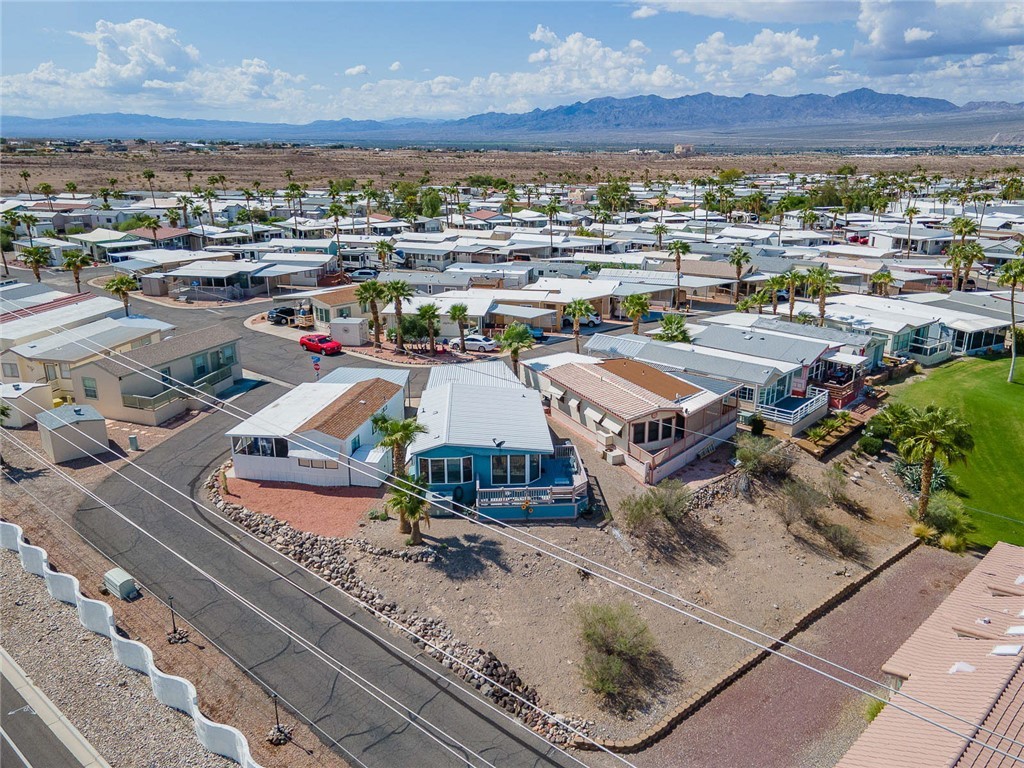 2000 Ramar Road, Unit 587 Bullhead City, AZ 86442 - Photo 54 of 79 Aerial view of residential area with a mountainous background