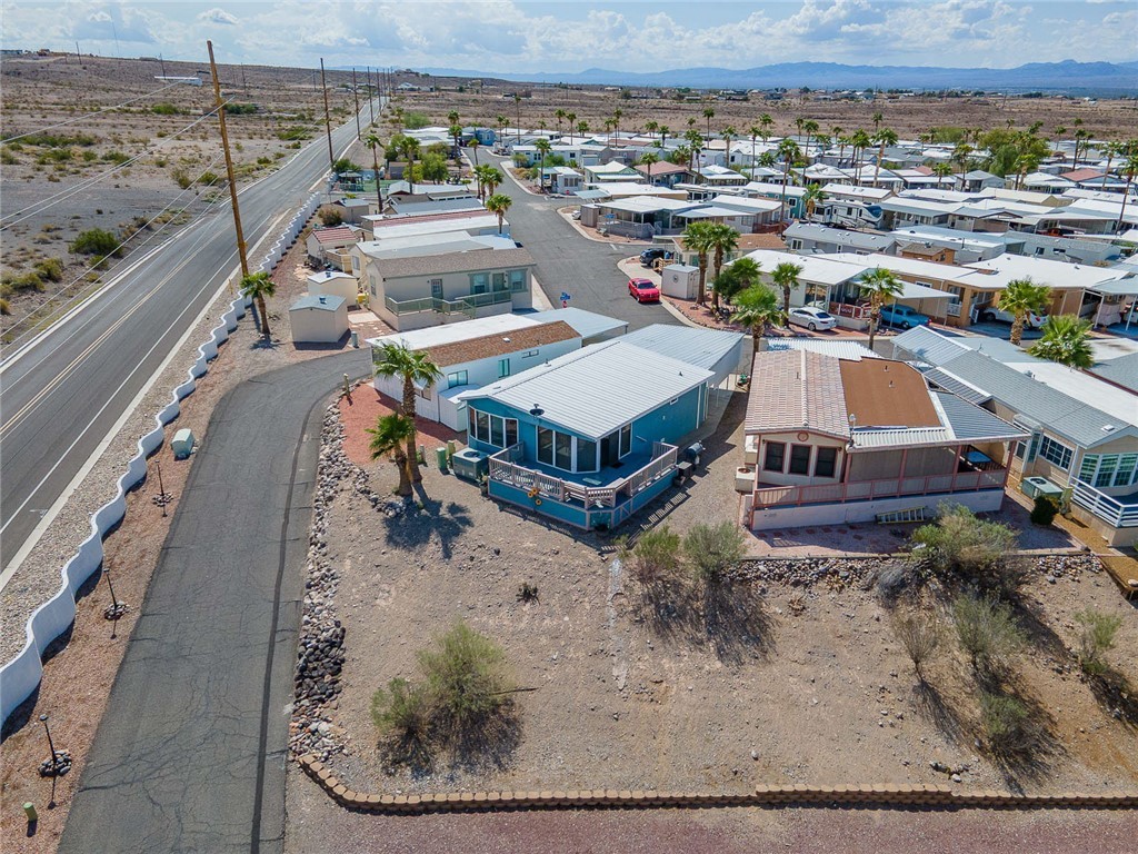 2000 Ramar Road, Unit 587 Bullhead City, AZ 86442 - Photo 58 of 79 Aerial perspective of suburban area with a mountain backdrop