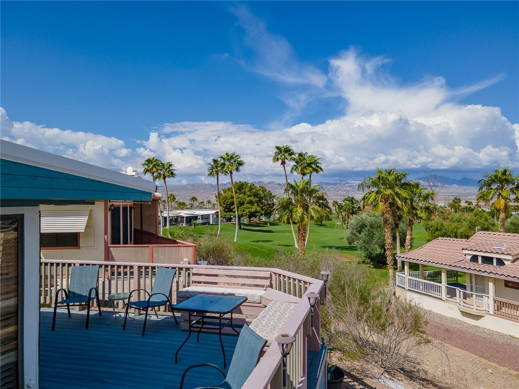 2000 Ramar Road, Unit 587 Bullhead City, AZ 86442 - Photo 5 of 79 Spacious deck overlooking the mountains and fairway. Perfect spot for outdoor dining and sunsets