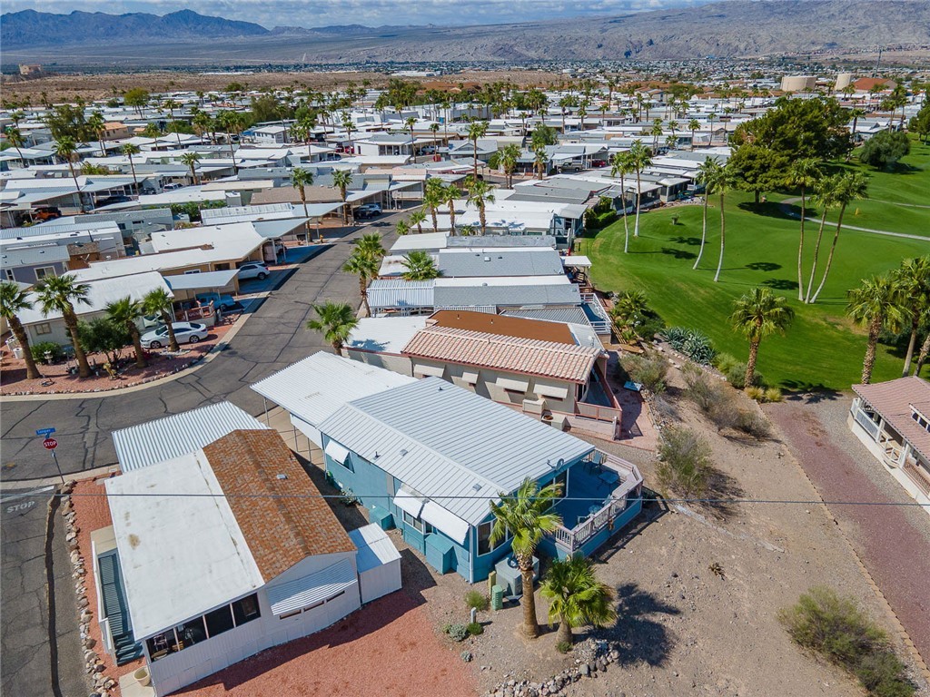 2000 Ramar Road, Unit 587 Bullhead City, AZ 86442 - Photo 60 of 79 Aerial perspective of suburban area with a mountain backdrop