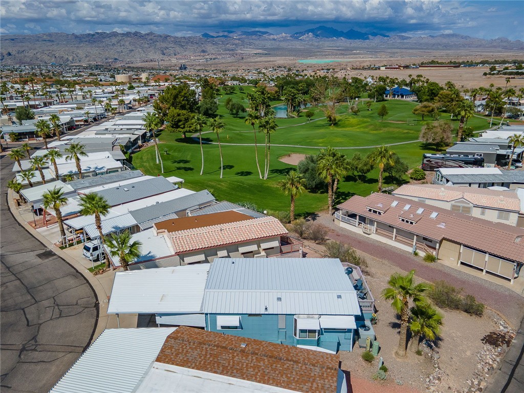 2000 Ramar Road, Unit 587 Bullhead City, AZ 86442 - Photo 61 of 79 Aerial view of residential area with a local golf course and mountains