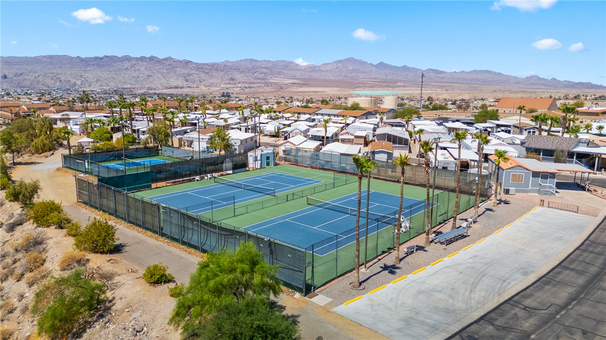 2000 Ramar Road, Unit 587 Bullhead City, AZ 86442 - Photo 75 of 79 Aerial perspective of suburban area with a mountainous background