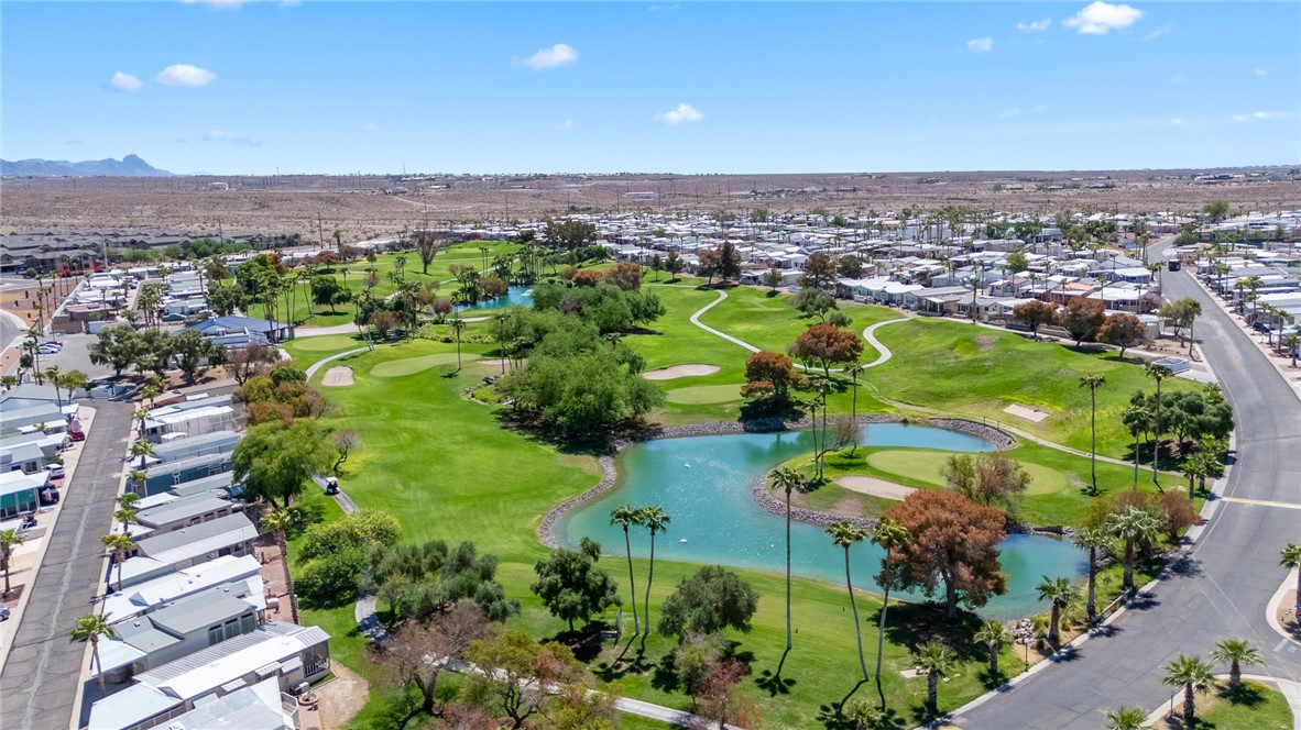 2000 Ramar Road, Unit 587 Bullhead City, AZ 86442 - Photo 77 of 79 Aerial view of property's location with nearby suburban area, a nearby body of water, and a local golf course