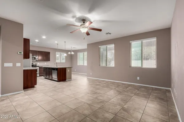 a view of kitchen with a sink dishwasher a refrigerator and a microwave