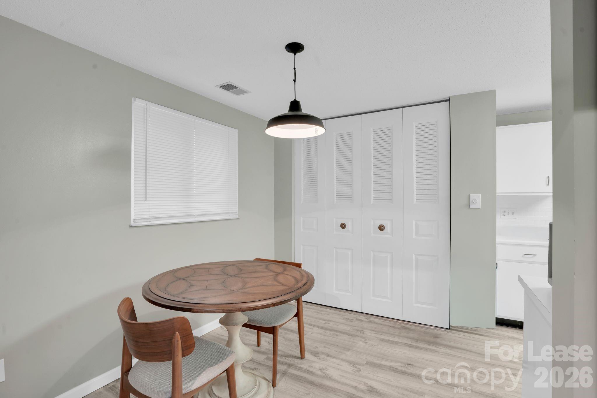 2427 Studley Road Charlotte, NC 28212 - Photo 12 of 30 a view of a room with a table and chairs